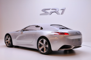 Fareham Car Garage - Shiny silver SR1 Peugeot car in a studio